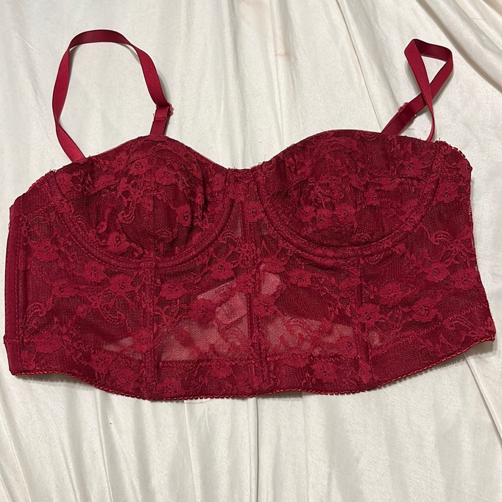 Dark red cropped corset top.